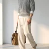 Jersey polo de punto a rayas con cremallera de un cuarto para hombre, hecho a medida